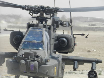 AH-64 Apache
Mike Caudle Photo

In the photo of the AH-64 Apache is the brigade commander sitting in the gunners seat and Maj WSelch in the pilots seat.
