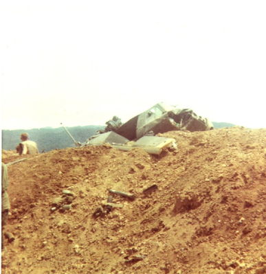 Crashed 229th UH-1
Bob Witt Photo

Crashed 229th on the top of LZ Tiger, April 1968
