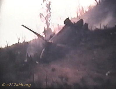Chinook Down
Photo provided by Bob Witt

Taken from Tiger April 1968
This is from an 8mm film that Lt. Sprayberrys Battalion surgeon took from the top of Tiger. The AC & CP walked into Sprayberry's perimeter 2 days later after E&E. They followed the sound of chain saws they heard being used on the LZ.

