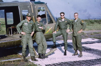 #64-13740 at Golf Course, 15th TC Pad
John Keller Photo

#64-13740 at 15th TC Pad - Golf Course, SEPT, 1966, with crew
RIGHT to LEFT: SP4/CE Dan â€œHarryâ€ Harrison, WO1 John L. Keller, SP4/DG James Leo Hatton, SP4/DG ?Russell Parker??

From Chuck Stevens CE: "the pic of a/c #64-13740 and WO1 Keller and Dan Harrison, that was my a/c and Dan was my replacement. pic must have been taken right after I left country."

