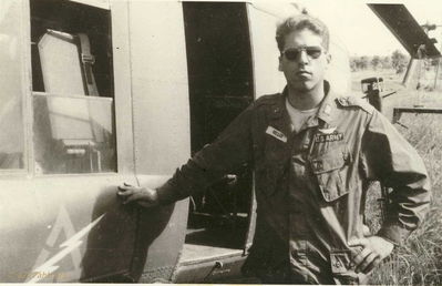 At an LZ west of TUY HOA
John Keller Photo

WO-1 John Keller at an LZ west of TUY HOA on July 4th 1966. Temperature is 122 degrees! Another "warm" summer day!


