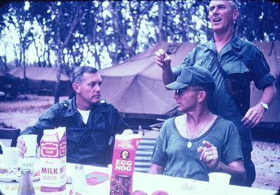 Left to Right:  Lt Col Covington (227th Battalion CO), SGT Scanlon, (A/227 First Sargeant) and Battalion First Sargeant (standing)
Bert Williams Photo
Lai Khe AO

Christmas 1968
