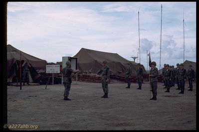 A/227 Ceremony
Jim Brodie Photo

Camp Evans - 1st Sgt next to the tent taking photo - I don't know what the ceremony was for.

