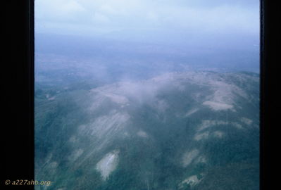 Tiger Mountain
Bob Kelly Photo

Tiger Mountain in the A Shau Valley. This is a picture of war taking during Operation Delaware. Mountain elevation near 10,000 feet. Many craters from B-52 strikes.
