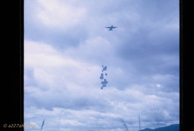 C-130 parachute resupply
Bob Kelly Photo

A C-130 parachute resupply in the A Shau Valley. One stray almost hit four of us who slept in the valley.

