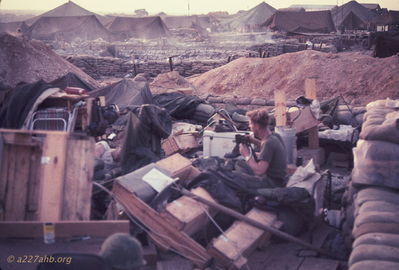 LT Sawyer salvaging
Bob Kelly Photo

LT Sawyer salvaging what hecould. In the background Charlie Company (C/227) nearly all burned down.


