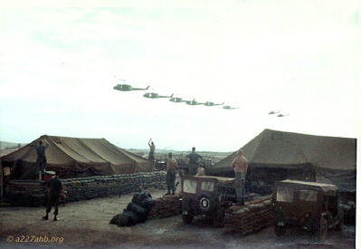 A/227 Fly By
Dave Jones Photo

A/227 Fly By over the Operations Tent. Sgt Pete and others looking on
Camp Evans 1968

