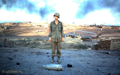 Unknown next to Artillery Round
Jerry Westenskow Photo

Camp Evans the day after the ammunition dump blew up.
I don't have names for the guys listed as unknown.

