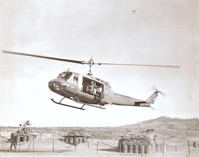 Chickenman 523 landing
Terry Moore Photo

Chickenman 523 landing at Tancan (sp?). Crash (Dennis Wheatly) aircraft commander in the left seat looking out the door, Crew Chief Ozark Joe (Terry Moore) seated in front of left gunners well.

