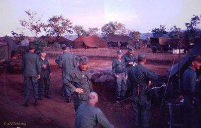 2nd Plt, Mike Jones, Pop Thorne, Ed Carder, Lance Fisher, Jim Sumler 
Cliff Richard Photo

Additional information from John Keller:
"From left: Face to camera is 1LT Richard Bryan. Next to the right maybe CW2 Clark Ward, back to camera (height and stance seems about right)?
Next, ID'd as Ed Carder is actually SFC Patriquin (Right hand down byright front fatigue pants pocket) The person next to him with cigarette is also a Maintenance NCO, but I don't remember his name.
Then, far right, profile view is: WO-1 William S. Robertson (also known as "Little Robbie)."
The others are difficult to ID, especially CPT Hutton and CPT
Callender, because their facial profiles are a lot alike. I think CPTHutton may be the one sitting down reading the news paper (facing to the right)?"
