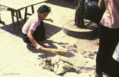  Phan Thiet sweeping the sidewalk '67 
JP Edwards Photo
