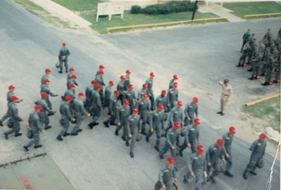 Marching WOC
Ernie Kramer Photo

Marching to the bus to take us to the flight line.
Note: New guys, above right, with their orange portfolios on the ground.
