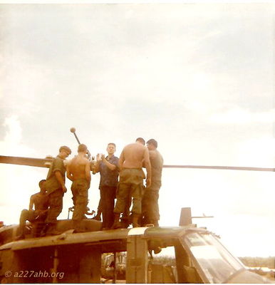 Photo with â€œAliceâ€ with maintenance crew on top of helicopter.
Dwayne Guidry Photo

We had a USO tour that came to Lai Khe, Ron Ely (Tarzan) and Alice from The Brady Bunch.
Lai Khe 1970 - 1971

