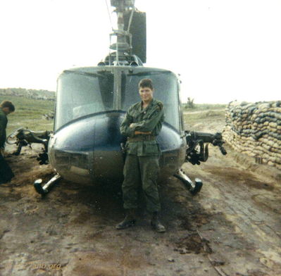 Mr. Kenard
Rickey McKay photo

 Warrant officer Kenard in front of my ship prior to take ,Dean Houstman is to left uncovering mini guns 
