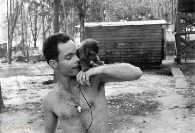 Mickey Barry with Christie at Lai Khe
Mickey Barry Photo
Lai Khe
I took over the care of Christie our monkey, after SP5 Friday ( I still have his harmonica that didnâ€™t get packed when we got his stuff shipped home!) and crew got shot down, and all went home! 

