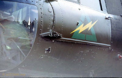 A/227 A/C Damage
Tom Johnson Photo

Tail Number 65-1006
Later transferred to B/227 and shot down flying C/C in I Corps

