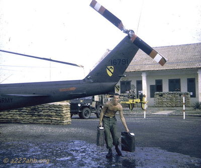John Rush
Richard Penny Photo

Gunner John Rush with running water. A/C 66-16791 on stand-by as CC bird late 1967, Phan Thiet.
