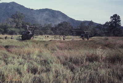 Yellow One ready to lift off
Bob Kelly Photo

Waiting for tail end charlie's "all out". Orbiting gunship above.
A series of nine photos showing the insertion of troops during a Combat Assault
