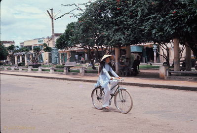 Young lady riding bike wearing Au Dai
Bob Kelly Photo
