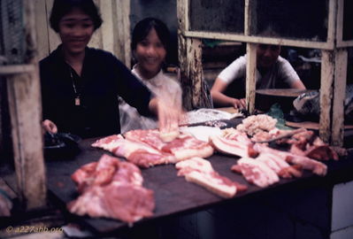 Slicing bacon
Bob Kelly Photo

Meat cutter slicing bacon in Phan Thiet meat market.
