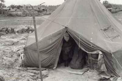 WO-1 William S. Robertson
John Keller Photo

Hammond, January 1967. WO-1 William S. Robertson getting out of the hex tent.


