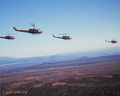 A/227 Slicks during Combat Assault
John LaDue Photo

The photo was probably taken 11/12/67. It's ships from A/227th, with what I assume are grunts from 2/7th sitting in the cabins. I think it's the last CA I escorted before DEROS. The ships are full, so we must be enroute to the LZ.


