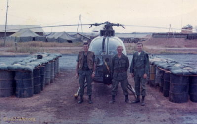 HHC Flight Line
Bob Witt Photo

Nick Johnson and OPS guys in front of the HHC Loach (OH-6A)

