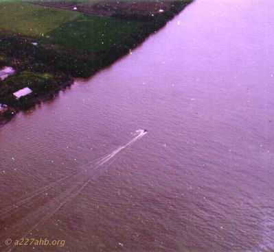 River near Saigon
Howard Burbank Photo

This photo shows someone water skiing 
