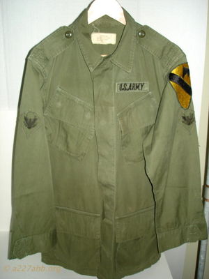  One of my personal jungle jackets,the spec 4 insignias are hand enbroidered 
Dennis Burden Collection
