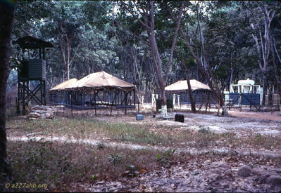 Tents in first company area
Wayne Trucke Photo

1969  Lai Khe

We moved to a new location and were put in "buildings" with wooden floors and sides halfway up and screens the remainder of the way. The roof was tin. 
