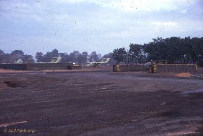 Lai Khe flight line, with, I believe, the planes to be OV-10 Bronco and an OH-6A Cayuse in revetment 
Wayne Trucke Photo

1969
