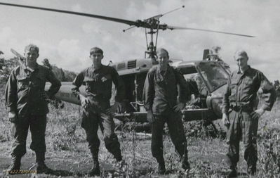 Cambodia in May 1970
Larry Vetter Photo

I am the one on the far right.  This photo was taken by a newsman from Look Magazine.  Was wondering if anyone out there could ID the other three.  The Aircraft was 68-15624 AKA captain Zig Zag.
